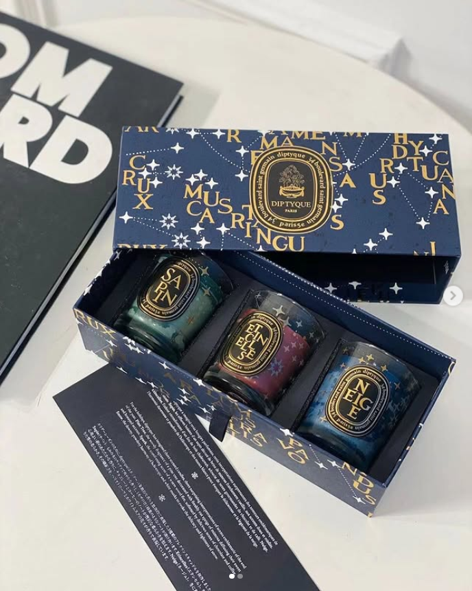 Diptyque Limited Edition Scented Candles Gift Set, which includes three 70g candles in star-adorned packaging. - diptyque Candles | Aleppo Gift UAE